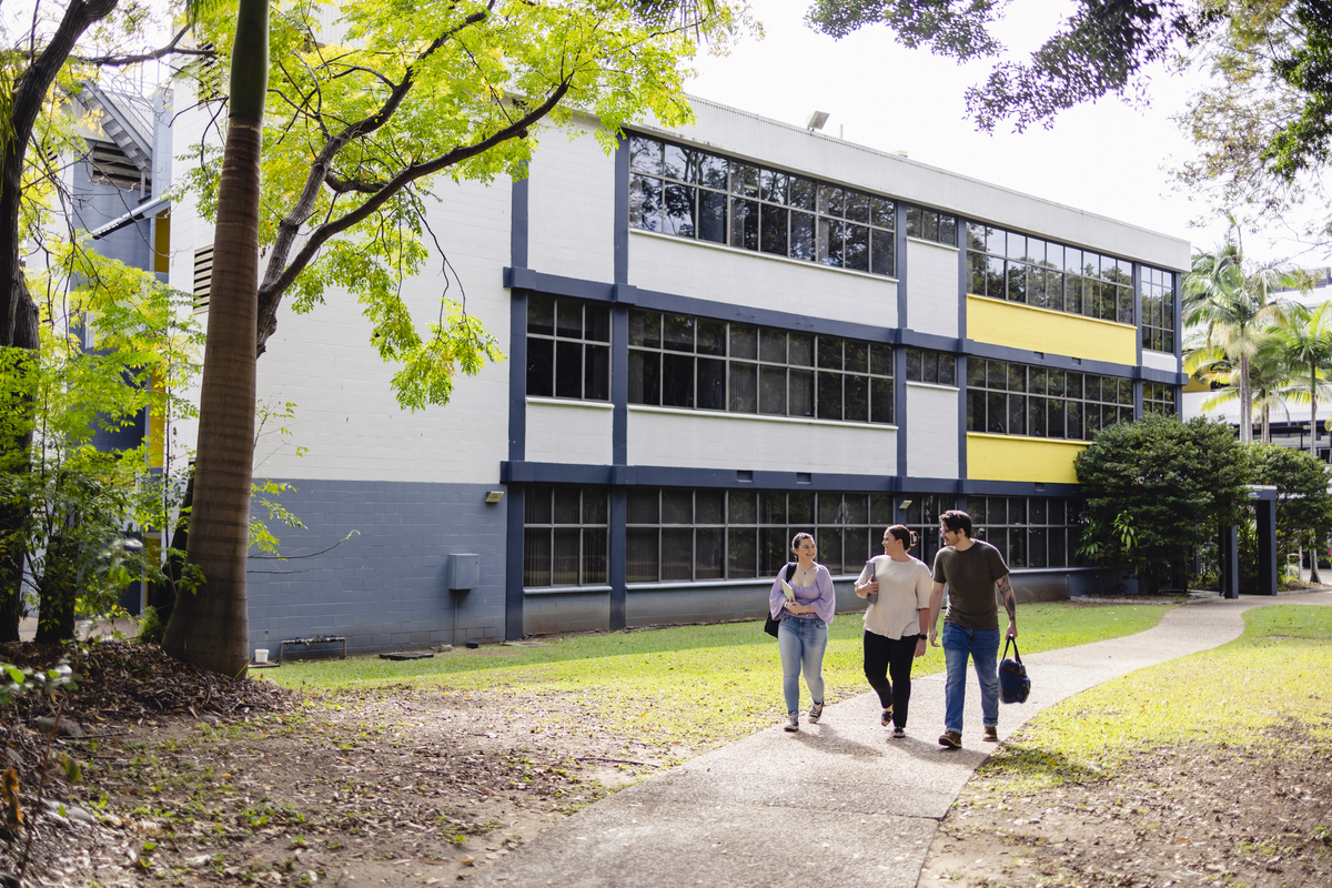 Three students walking outside on Rockhampton campus.