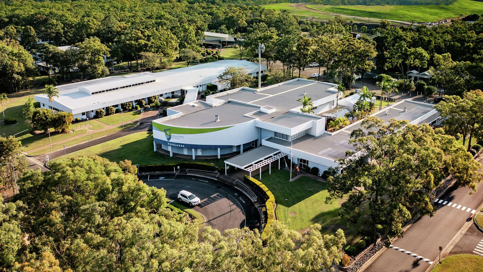 Arial view of Bundaberg campus surrounded by trees