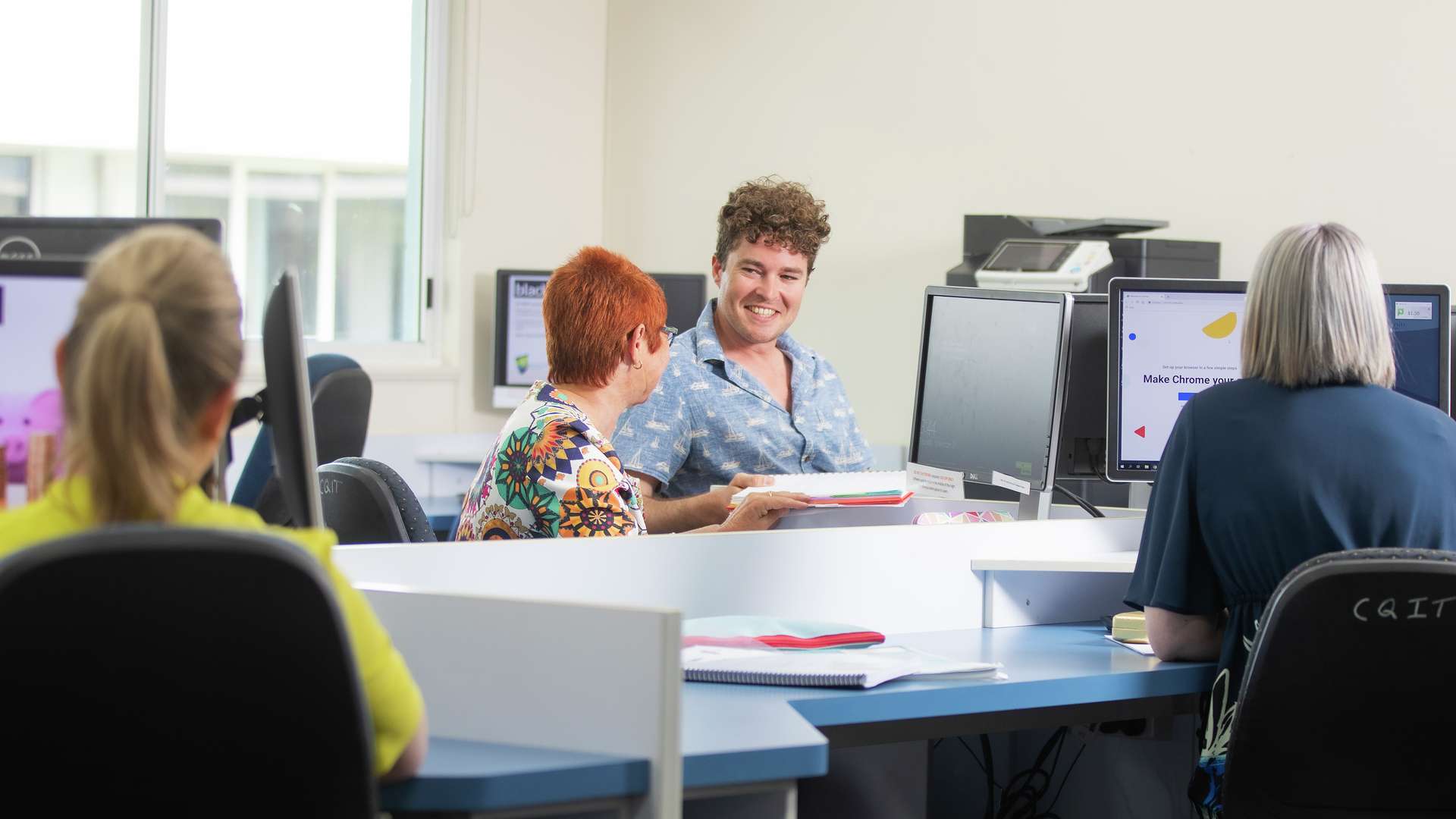 STEPS students work together in a computer lab.
