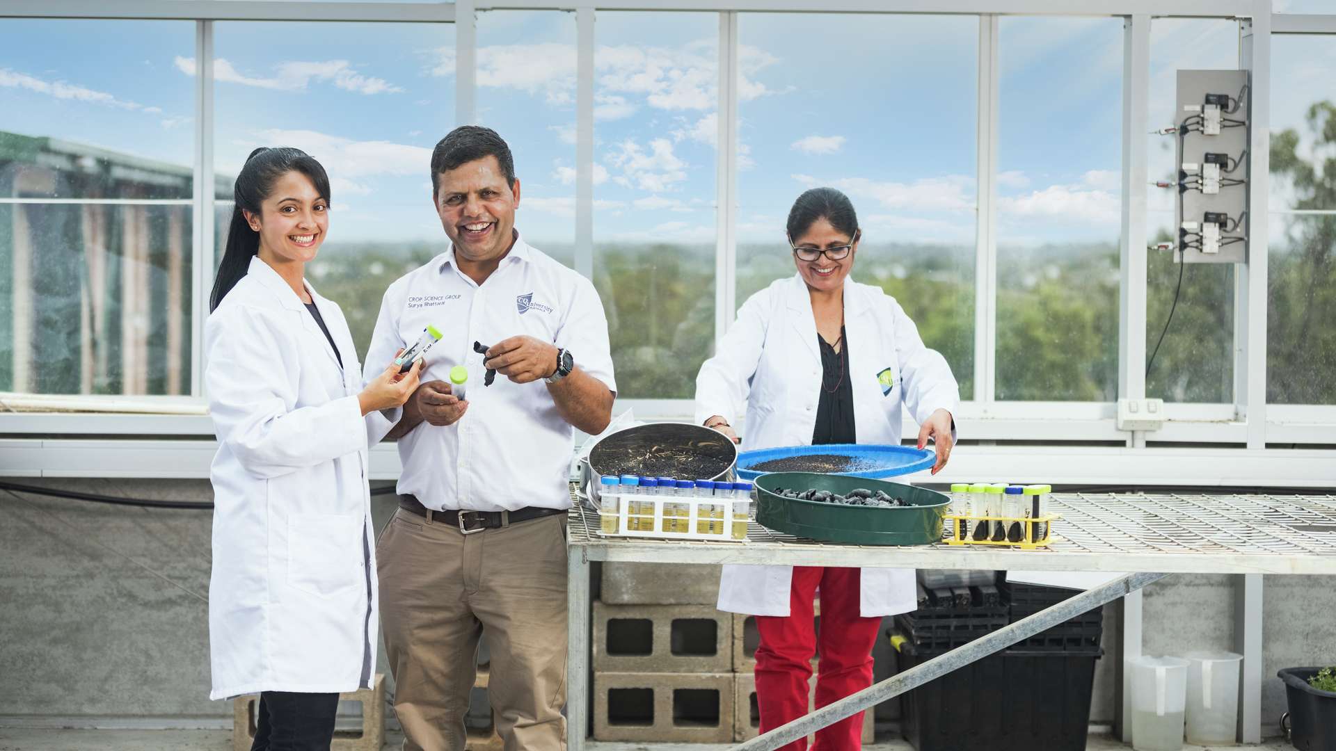 Agriculture Researchers testing soil and looking at samples