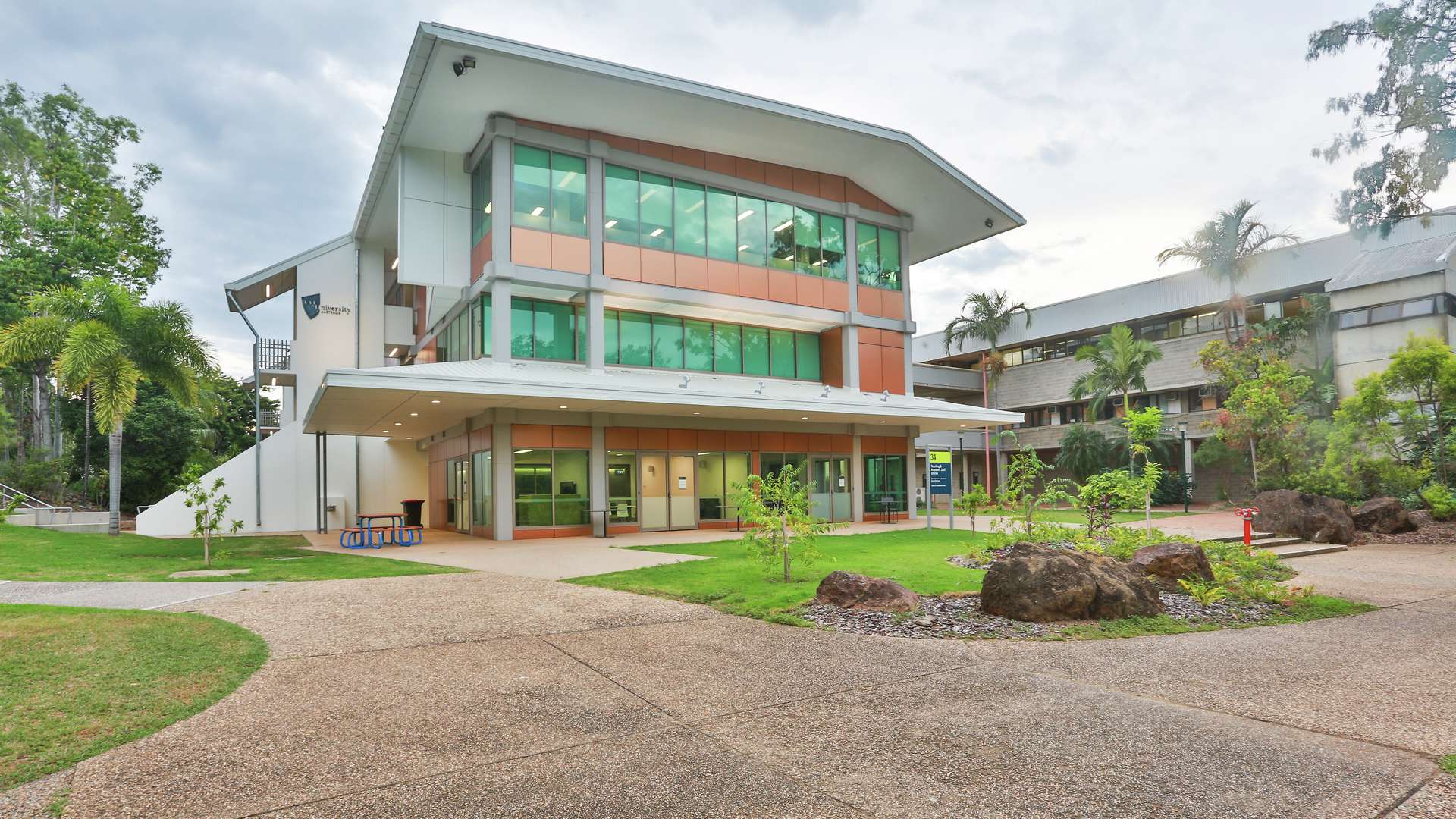 CQU Rockhampton campus building surrounded by landscaped gardens and pathways